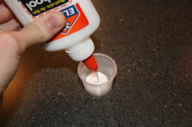 Squeeze some glue into your glue cup.
